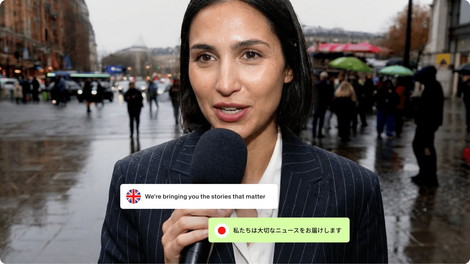 Female reporter with a microphone on a rainy street with a subtitle graphic translating English audio into Japanese.