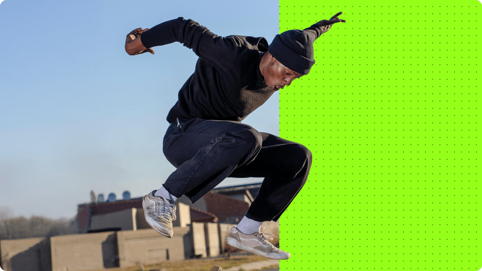 A man jumping mid air with a split screen displaying an outdoor background changing to a bright green screen.
