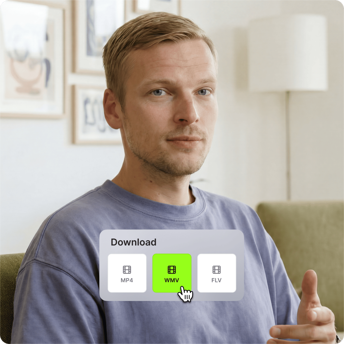 Man sitting on a sofa selecting the green WMV file download option panel inside VEED video converter platform.