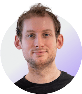 Circular profile photo of a person with white-to-purple gradient background.
