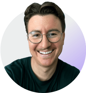 Smiling person with glasses and dark shirt in circular profile avatar with purple gradient background.